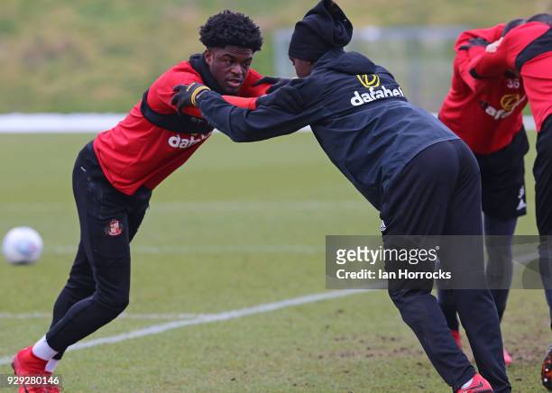 Josh Maja and Joel Asoro stretch during a Sunderland training session at The Academy of Light on March 8, 2018 in Sunderland, England.