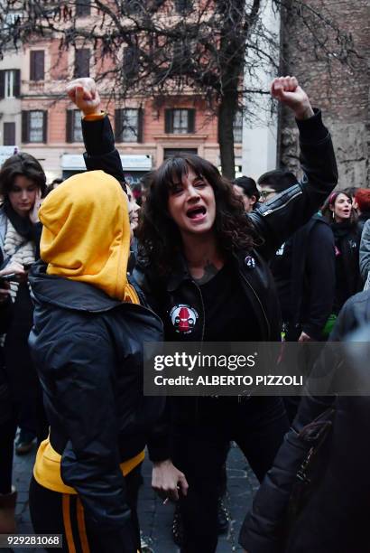 Italian actress Asia Argento and US singer and actress Rose McGowan , who both accuse Harvey Weinstein of sexual assault, take part in a march...