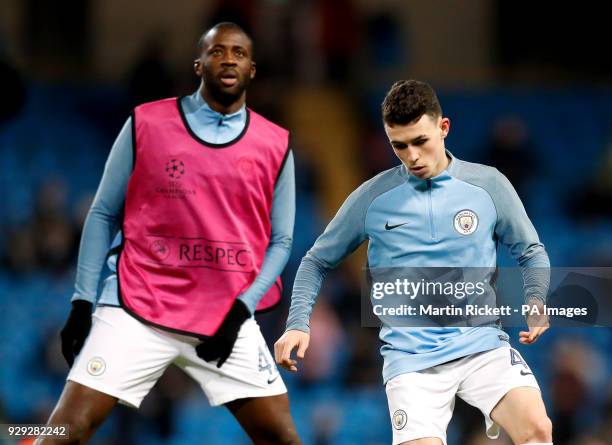 Manchester City's Yaya Toure and Manchester City's Phil Foden before the UEFA Champions League round of 16, second leg match at the Etihad Stadium,...