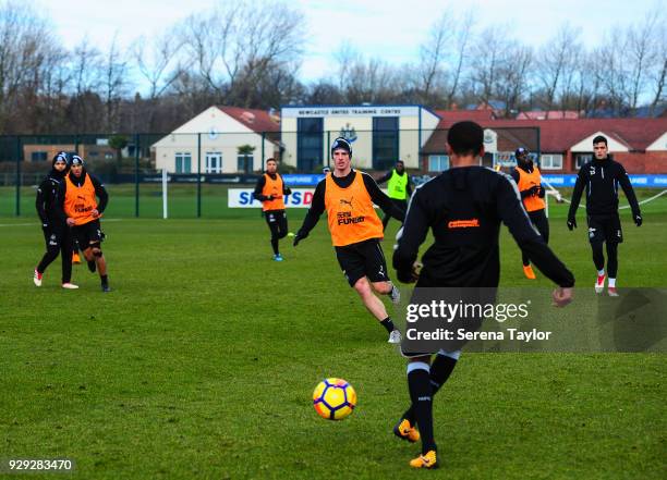 Ciaran Clark looks to close down a pass whilst playing possession during the Newcastle United Training session at the Newcastle United Training...