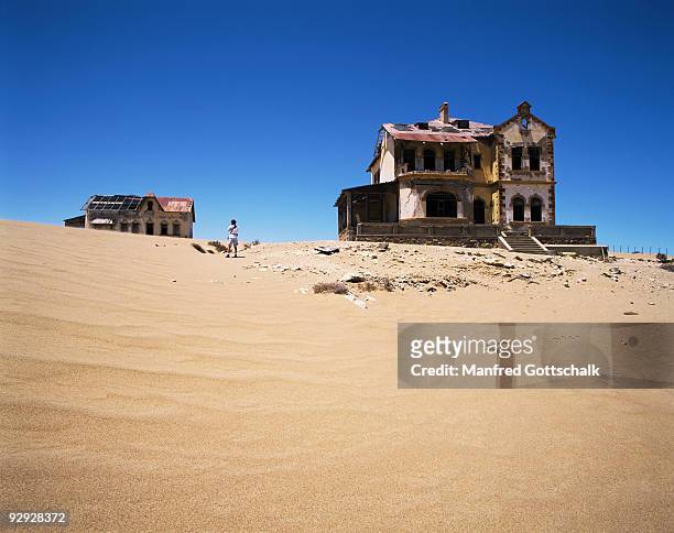 ghost town at the restricted diamond area , kolmanskop , namibia - kolmanskop stock pictures, royalty-free photos & images