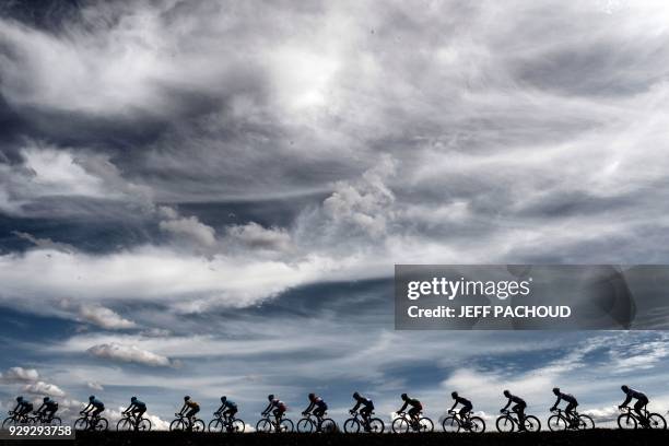 Cyclists ride during the 165km fifth stage of the 76th Paris-Nice cycling race between Salon de Provence and Sisteron on March 8, 2018. / AFP PHOTO /...