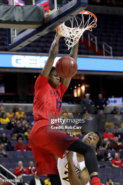 Kostas Antetokounmpo of the Dayton Flyers dunks over Khris Lane of the Virginia Commonwealth Rams in the first half during the second round of the...