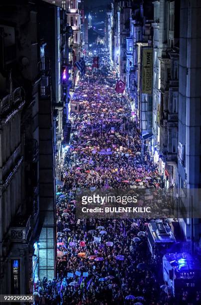 Women march on Istiklal avenue in Istanbul on March 8 February, 2018 during a demonstration to mark International Women's Day. / AFP PHOTO / BULENT...