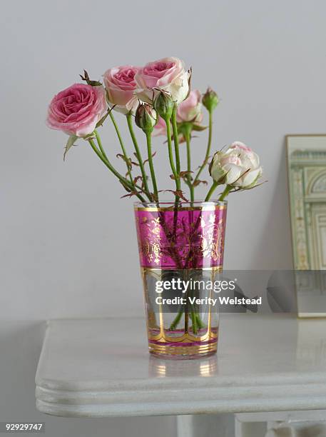 pink roses in a vase on a table - rosa mantel stock pictures, royalty-free photos & images