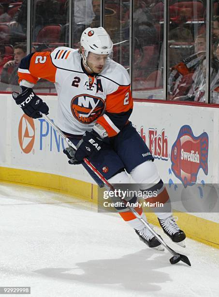 Mark Streit of the New York Islanders plays the puck against the New Jersey Devils during their game at the Prudential Center on November 6, 2009 in...