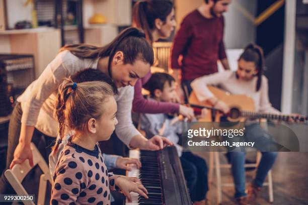 children in music school - young musician stock pictures, royalty-free photos & images