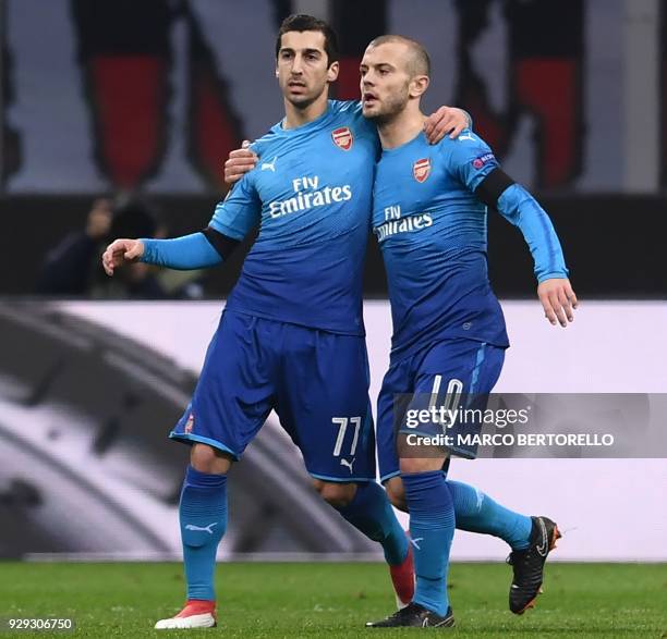 Arsenal's midfielder Henrikh Mkhitaryan of Armenia celebrates after scoring with Arsenal's midfielder Jack Wilshere of England during the UEFA Europa...