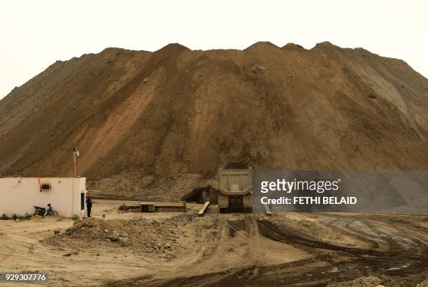 Truck transports earth the Metlaoui phosphate production plant on March 8 in the Metlaoui mining region, one of the main mining sites in central...