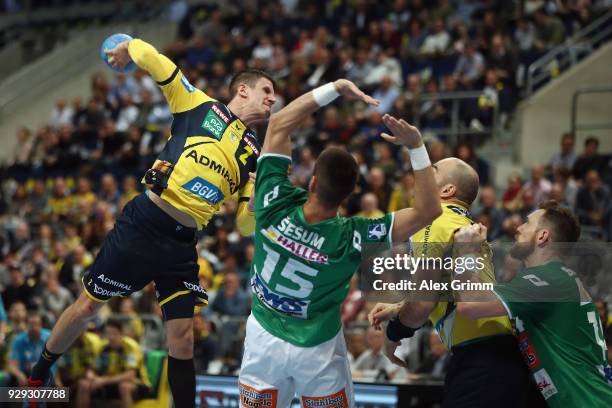 Andy Schmid of Rhein-Neckar Loewen is challenged by Zarko Sesum of Goeppingen during the DHL HBL match between Rhein-Neckar Loewen and Frisch Auf...