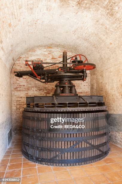 Contratto wine producer in Canelli. An ancient wine press Marmonier for a soft pressure of Moscato and Pinot grapes. Asti. Piemonte. Italy. Europe.