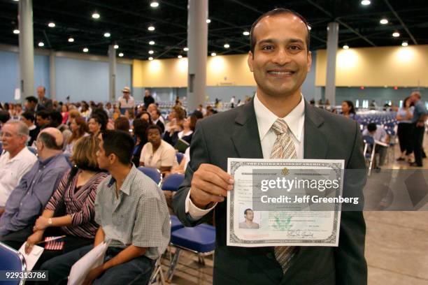Man with a Certificate of Naturalization at the naturalization ceremony at Miami Beach.