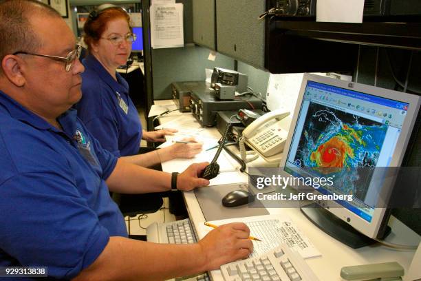 Volunteer ham radio operators communicating with those in path of Hurricane Ivan.