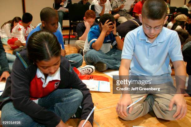 Elementary school students competing in the Miami-Dade & Monroe County Spelling Bee with word games during a break at Florida International...
