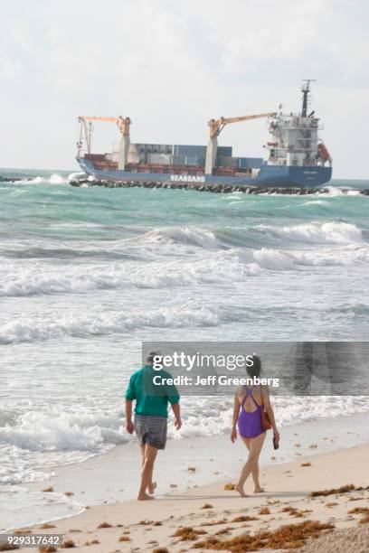 Couple walking on Miami Beach.