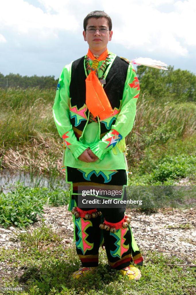 A boy in dancing regalia.