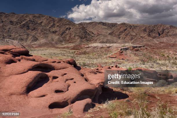 Outcrop of eroded red lava rock at Katutau Mountains Altyn Emel National Park Kazakhstan.