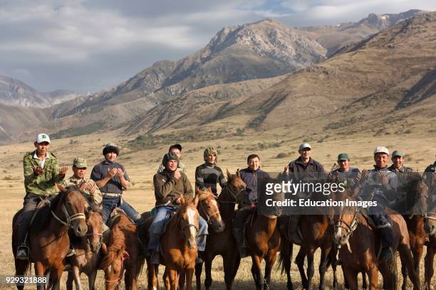 Horse riders praying and giving thanks after game of Kokpar Tudabarai in Aksu Zhabably Kazakhstan.