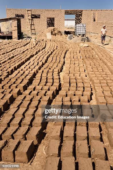 Mud Brick Stack Mud bricks laid out in the sun to dry at home construction site near ...