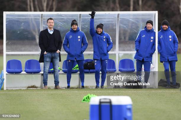 Chelsea Manager Antonio Conte and Carlo Cudicini with John Terry during a training session at Chelsea Training Ground on March 8, 2018 in Cobham,...