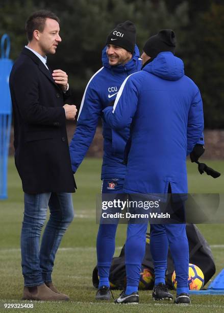 Chelsea Manager Antonio Conte and Carlo Cudicini with John Terry during a training session at Chelsea Training Ground on March 8, 2018 in Cobham,...