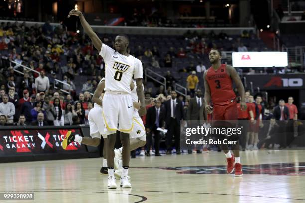 De'Riante Jenkins of the Virginia Commonwealth Rams follows his three point shot in the second half against the Dayton Flyers during the second round...