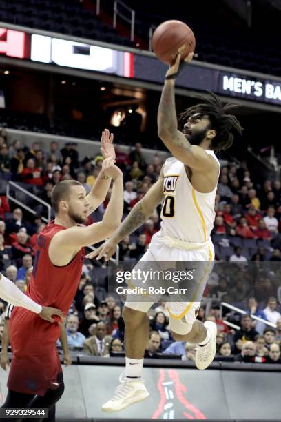 Jonathan Williams of the Virginia Commonwealth Rams puts up a second half shot in front of Matej Svoboda of the Dayton Flyers during the second round...