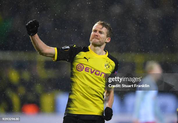 Andre Schuerrle of Borussia Dortmund celebrates as he scores their first goal during the UEFA Europa League Round of 16 match between Borussia...