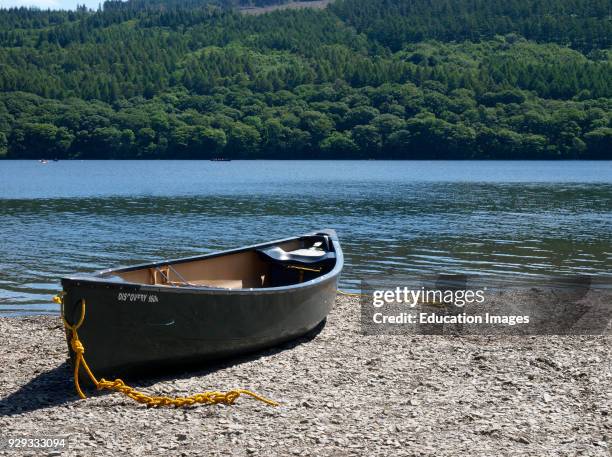 Canoe on the bank of Coniston Water, The Lake District, Cumbria, UK.