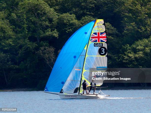 Sport sailors sailing dinghy on Coniston Water, The Lake District, Cumbria, UK.