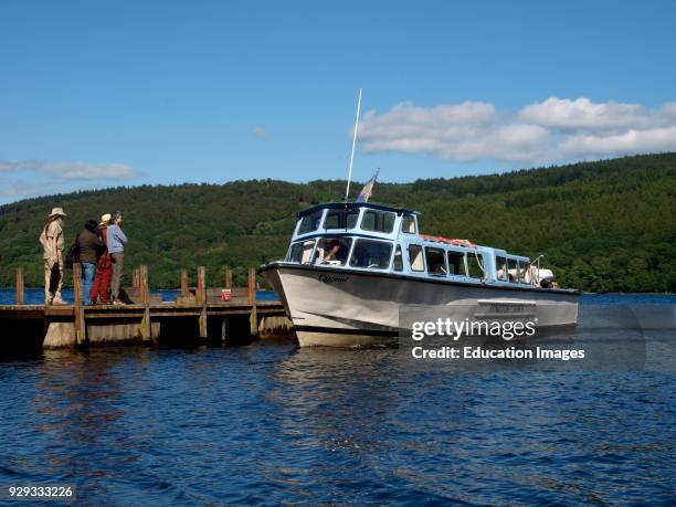 Coniston launch picking up passengers from the Torver Jetty, Coniston Water, The Lake District, Cumbria, UK.