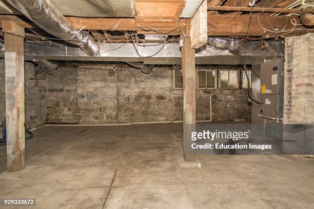 Unfinished basement interior of middle-class American home in Kentucky.