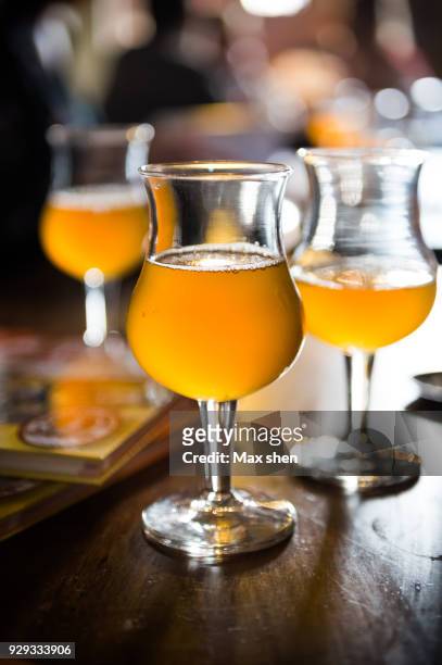close-up shot of belgian beer - belgian culture stock pictures, royalty-free photos & images