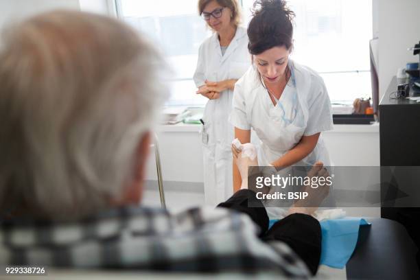 Diabetic feet consultations, Savoie, France, specialized team devoted to treatment and after-care for diabetic patients foot lesions. The nurse...