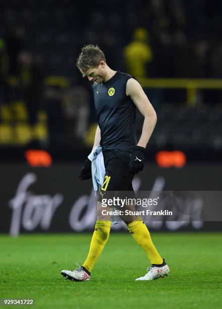 Andre Schuerrle of Borussia Dortmund looks dejected in defeat after the UEFA Europa League Round of 16 match between Borussia Dortmund and FC Red...