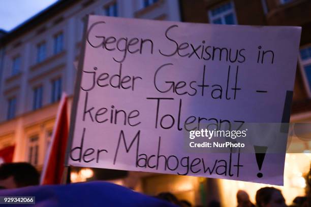 Sign saying 'Gegen Sexismus in jeder Gestalt - keine Toleranz der Machogewalt!' - 'Against sexism of every colour - no tolerance to macho violence!'...