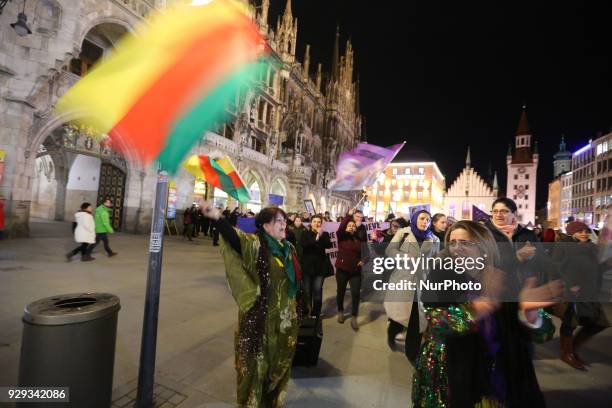 Kurdish activist waving a flag of Rojava. Some 400-500 people joined the feminist protest at the International Women's Day. The protest showed...
