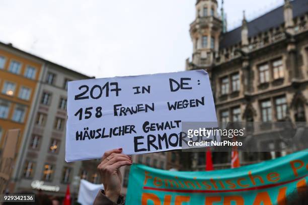 Sign saying '2017 in DE: 158 Frauen wegen Haeuslicher Gewalt Ermordet' - 2017 in Germany: 158 Women murdered because of domestic violence'. Some...