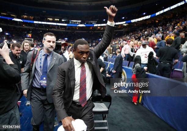 Avery Johnson the head coach of the Alabama Crimson Tide walks off of the court after Alabama beat the Texas A&M Aggies 71-70 during the second round...