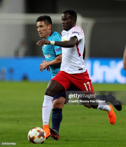 Bruma of RB Leipzig vies with Matas Kranevitter of FC Zenit Saint Petersburg during the UEFA Europa League Round of 16 match between RB Leipzig and...