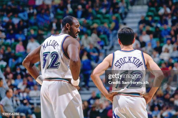 Karl Malone and John Stockton of the Utah Jazz look on circa 1997 at the Delta Center in Salt Lake City, Utah. NOTE TO USER: User expressly...