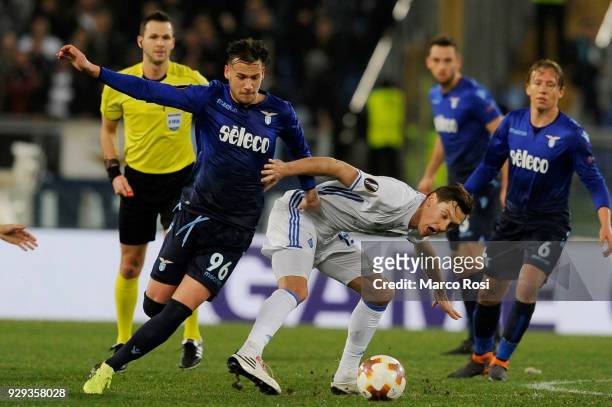 Alessandro Murgia of SS Lazio compete for the ball with Denys Garmach of Dynamo Kiev during UEFA Europa League Round of 16 match between Lazio and...