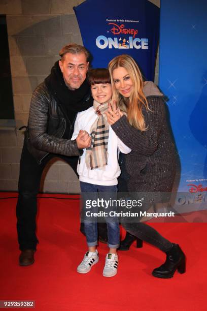 Sven Martinek and partner Xenia Seeberg together with their child Philias attend the Disney on Ice premiere 'Fantastische Abenteuer' at Velodrom on...