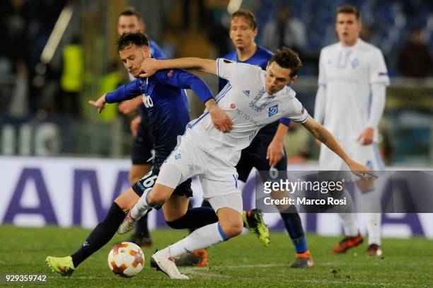 Alessandro Murgia of SS Lazio compete for the ball with Denys Garmach of Dynamo Kiev during UEFA Europa League Round of 16 match between Lazio and...