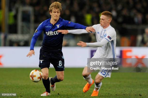 Dusan Bastas of SS Lazio compete for the ball with Viktor Tsygankov of Dynamo Kiev during UEFA Europa League Round of 16 match between Lazio and...