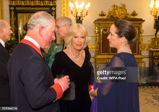 Prince Charles, Prince of Wales and Camilla, Duchess of Cornwall speak to Princess Zahra Aga Khan prior to dinner at Windsor Castle on March 8, 2018...
