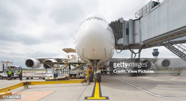 Aircraft docked to gangway at gate. Manchester Airport, Manchester, United Kingdom. Architect: n/a, 2015.