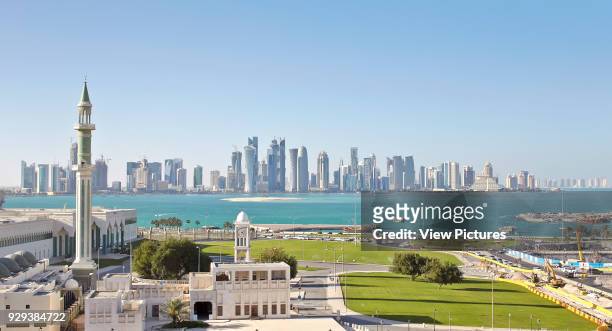 Msheireb Downtown Doha, Construction Site, Doha, Qatar. Architect: John McAslan & Partners, 2015. Panoramic view across water to Doha skyline.