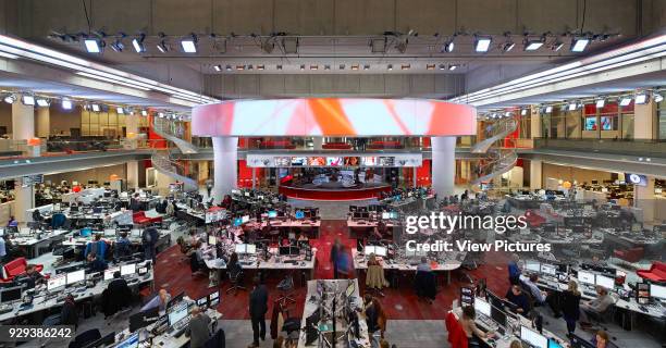 Broadcasting House, London, United Kingdom. Architect: HOK International Ltd, 2014. Panoramic view of atrium with newsroom and workstations.