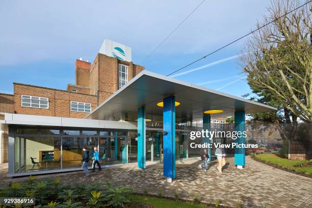 Rivers Academy West London, Feltham, United Kingdom. Architect: Jonathan Clark Architects, 2012. Canopy of main entrance with context.